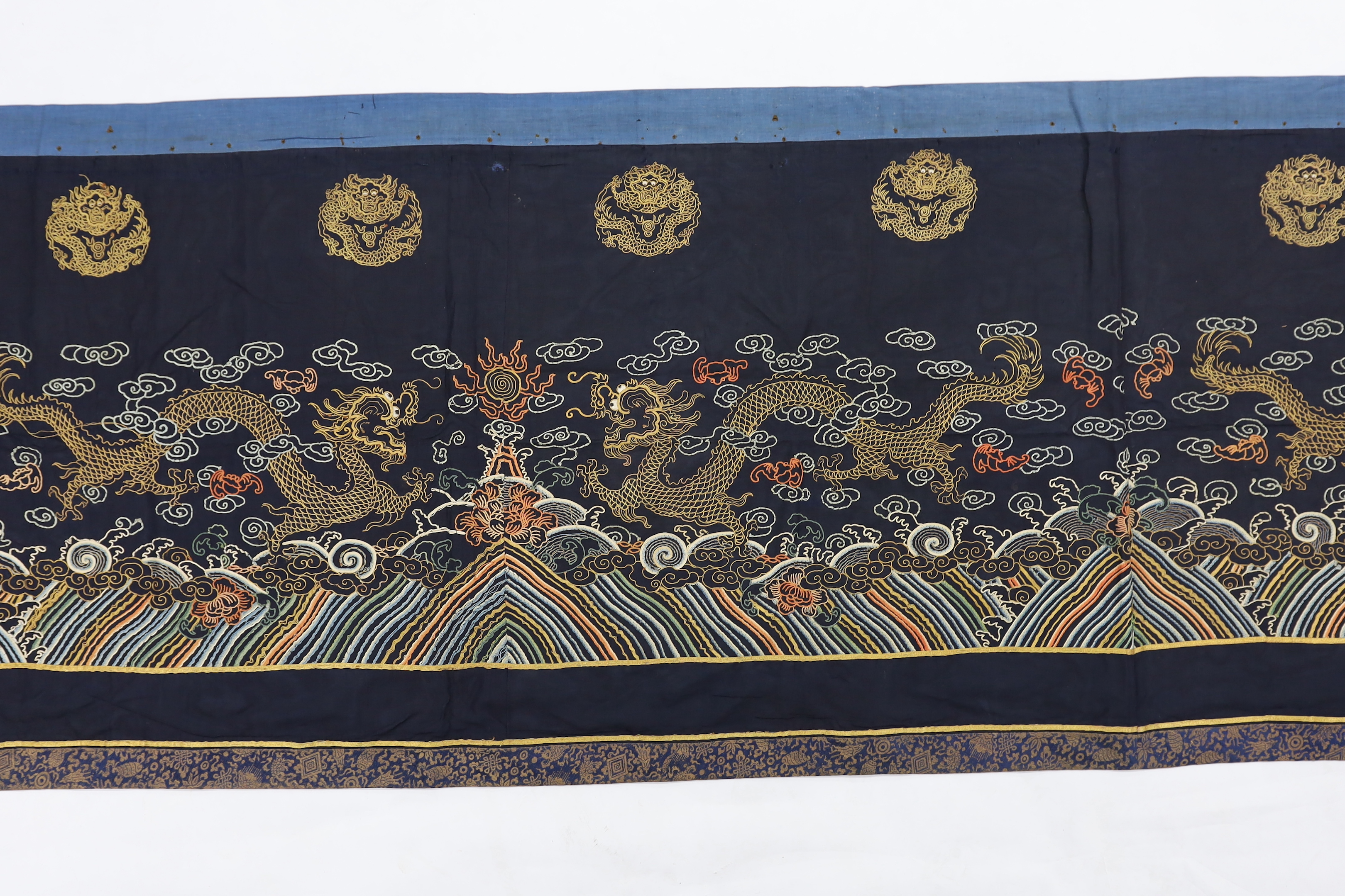 A Chinese long gauze gold dragon and multi-coloured embroidered altar cloth, with brocade borders, 290cm long x 78cm high